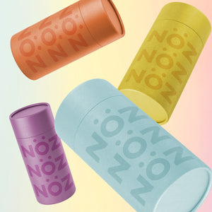 Orange, purple, yellow and blue sticks of Nöz sunscreen, the best reef safe, zinc oxide SPF for your face 